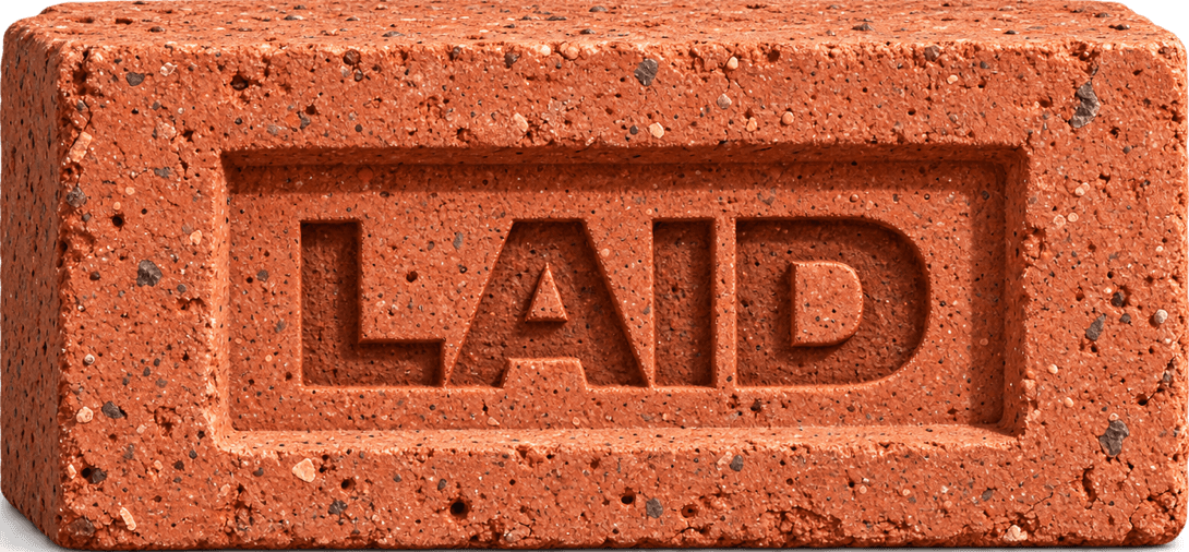 A brick stamped LAID